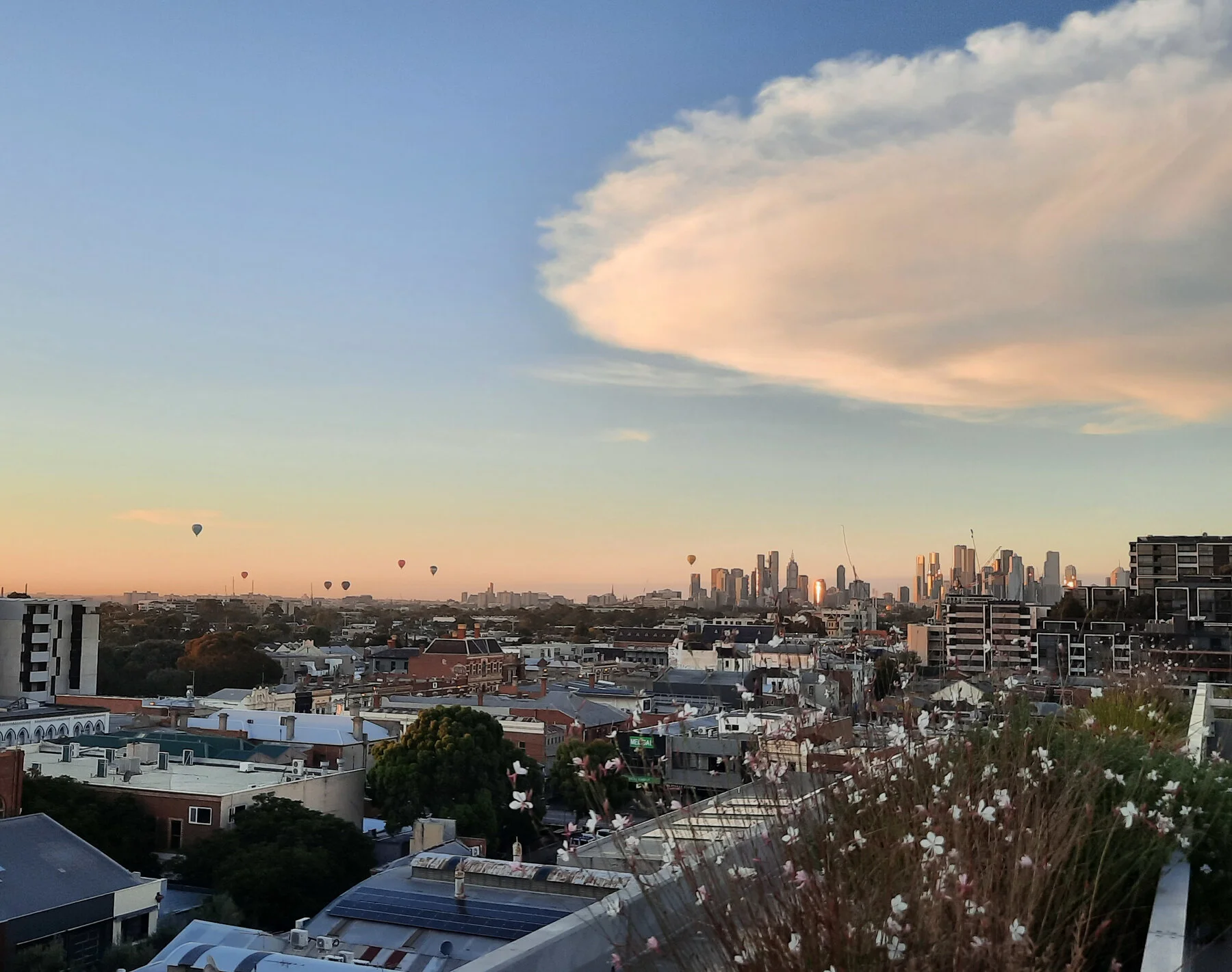 Laughing on the rooftop terrace with city views